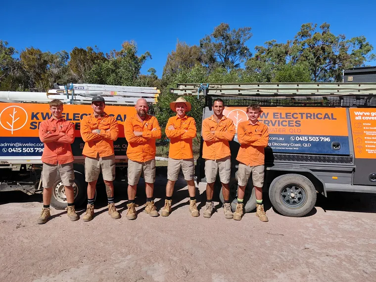 The KW Electrical Services crew in front of a branded work ute